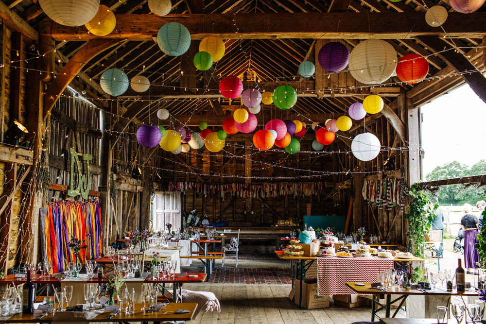 Multicoloured Paper Lanterns Fairy Lights Streamers Rustic Mismatched Secret Barn Sussex Wedding Rainbow Colourful Yvonne Lishman Photography