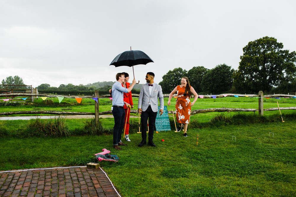 Lawn games Bunting Outdoor Secret Barn Sussex Wedding Rainbow Colourful Yvonne Lishman Photography