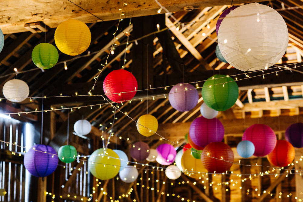Multicoloured Paper Lanterns Fairy Lights Secret Barn Sussex Wedding Rainbow Colourful Yvonne Lishman Photography
