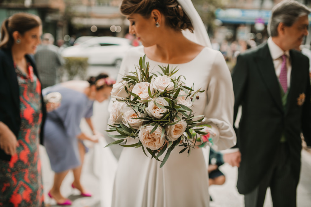 Outdoor Seville Destination Baroque Church Aisle Bride Green Blush Bouquet | Colorful and Heartfelt Wedding in Spain Boda&Films