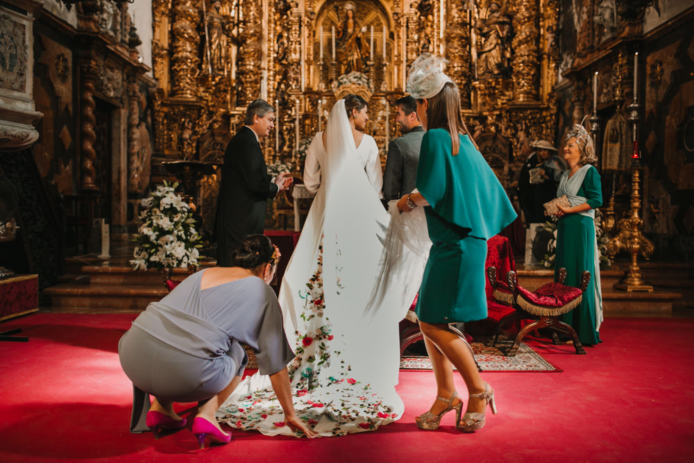 Outdoor Seville Destination Baroque Church Aisle Ceremony Bride Bridesmaids Veil | Colorful and Heartfelt Wedding in Spain Boda&Films