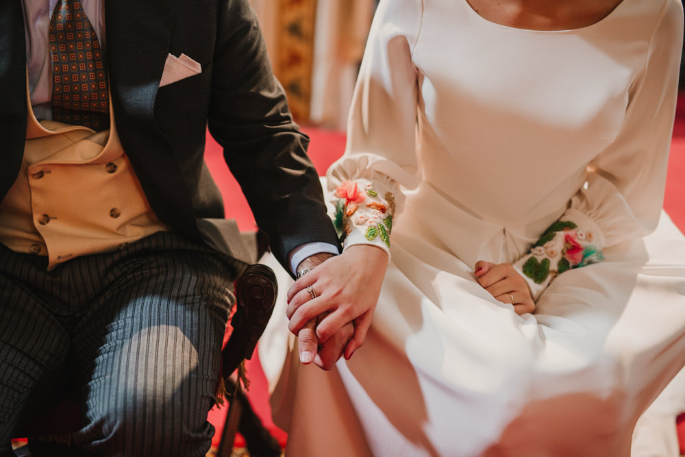 Outdoor Seville Destination Baroque Church Aisle Ceremony Bride Groom Rings | Colorful and Heartfelt Wedding in Spain Boda&Films