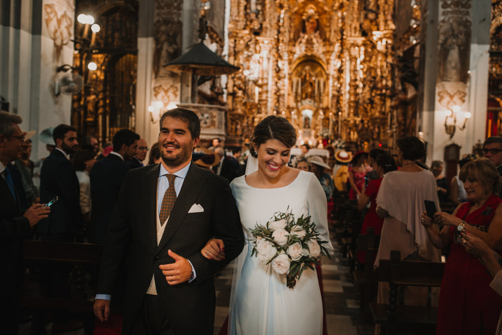 Outdoor Seville Destination Baroque Church Aisle Ceremony Bride Groom Blush Greenery Bouquet | Colorful and Heartfelt Wedding in Spain Boda&Films