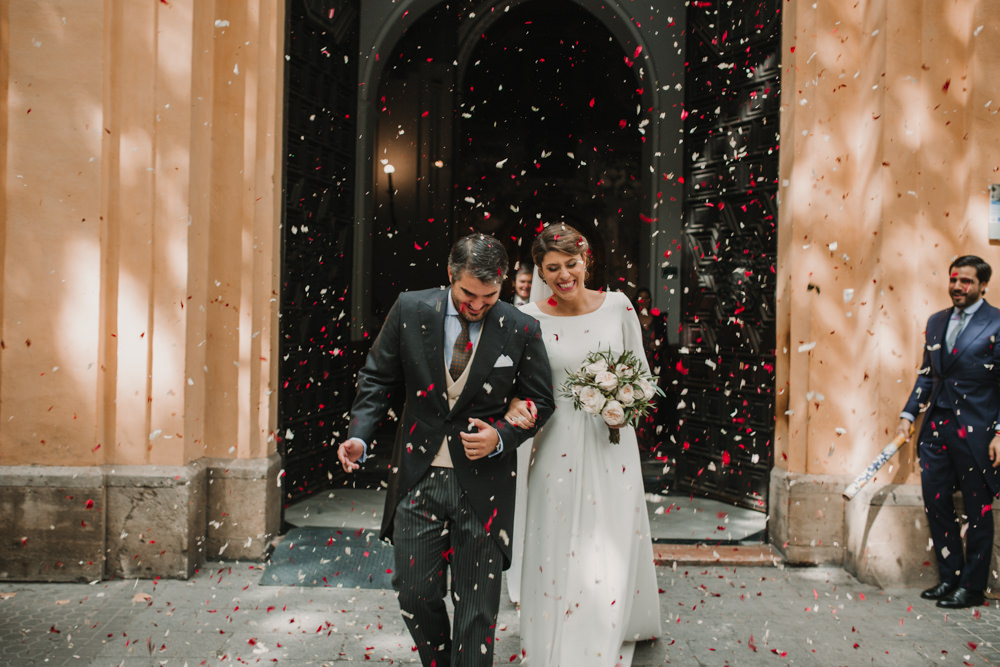 Outdoor Seville Destination Baroque Church Aisle Ceremony Bride Groom Confetti | Colorful and Heartfelt Wedding in Spain Boda&Films
