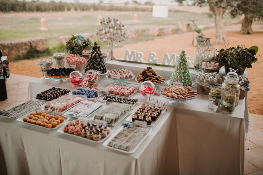 Outdoor Seville Destination Villa Hacienda Dessert Table | Colorful and Heartfelt Wedding in Spain Boda&Films