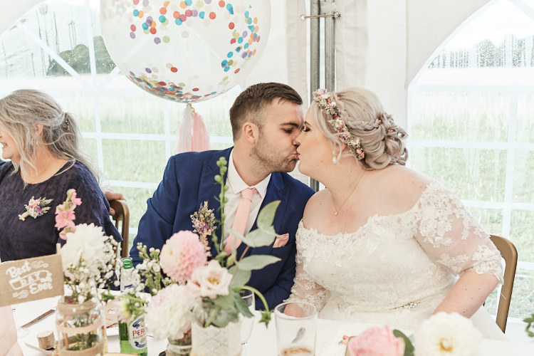 Bride Bridal A Line Sleeved Dress Gown Lace Off the Shoulder French Connection Groom Blue Waistcoat Three Piece Pink Tie Tasseled Confetti Balloons Dried Flower Crown Wood Farm Barn Wedding Suffolk Faye Amare Photography