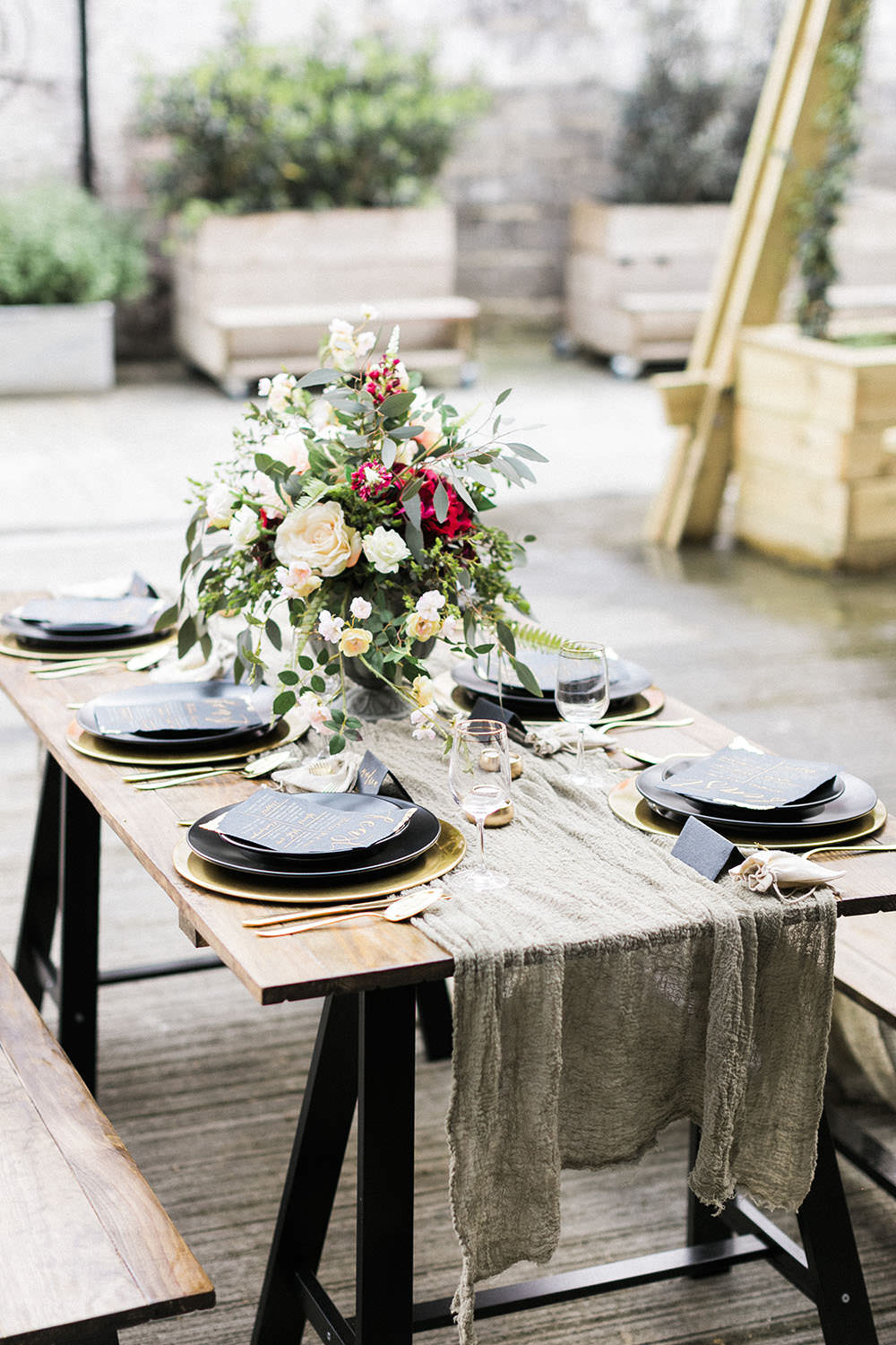 Tablescape Decor Muslin Linen Table Cloth Trestle Table Flowers Black Charger Plates Burgundy Gold Wedding Ideas Sarah Porter Photography