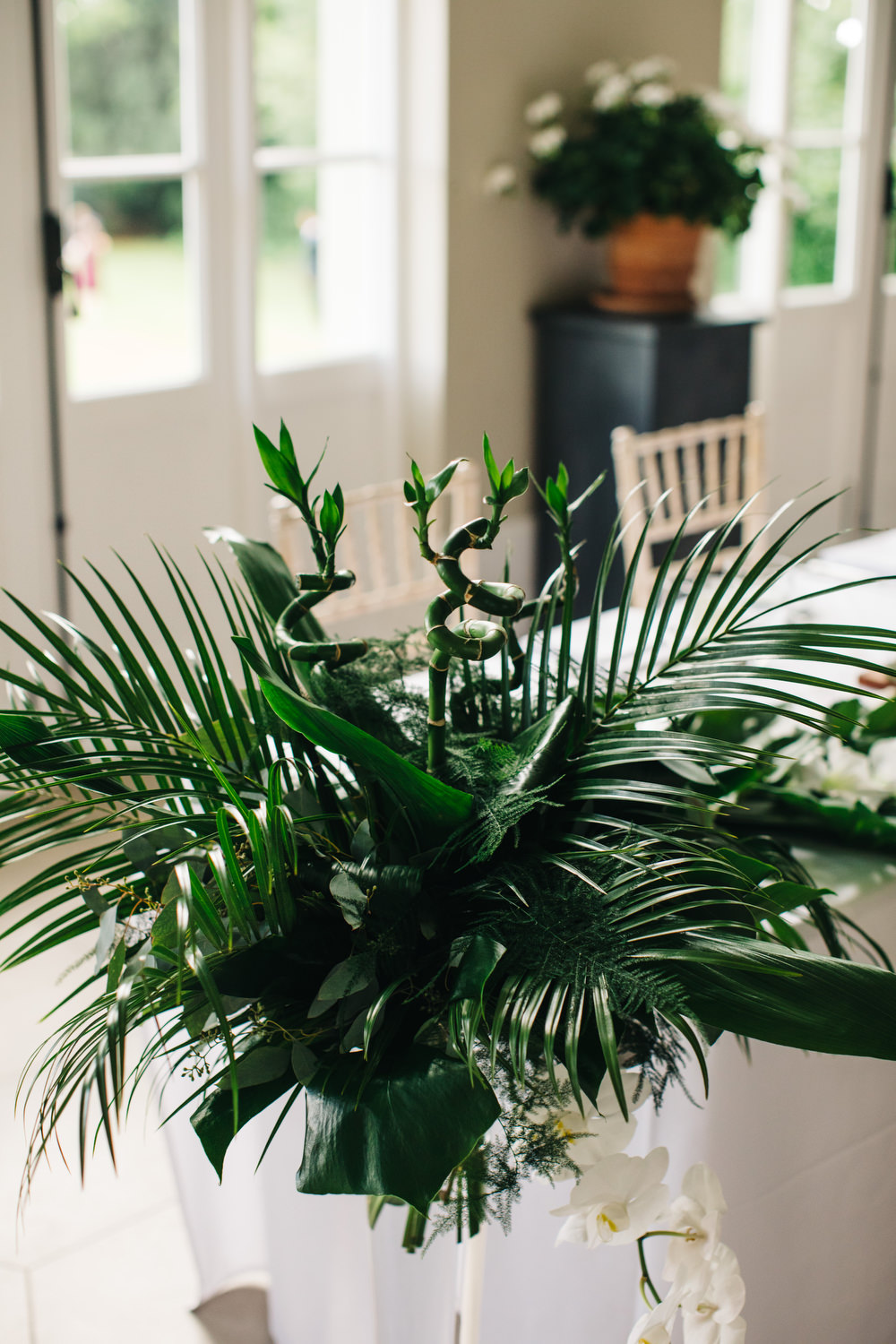 Tropical Centrepiece Flowers Decor Palm Leaves Leaf Greenery Table Deer Park Country House Hotel Wedding Richard Skins Photography
