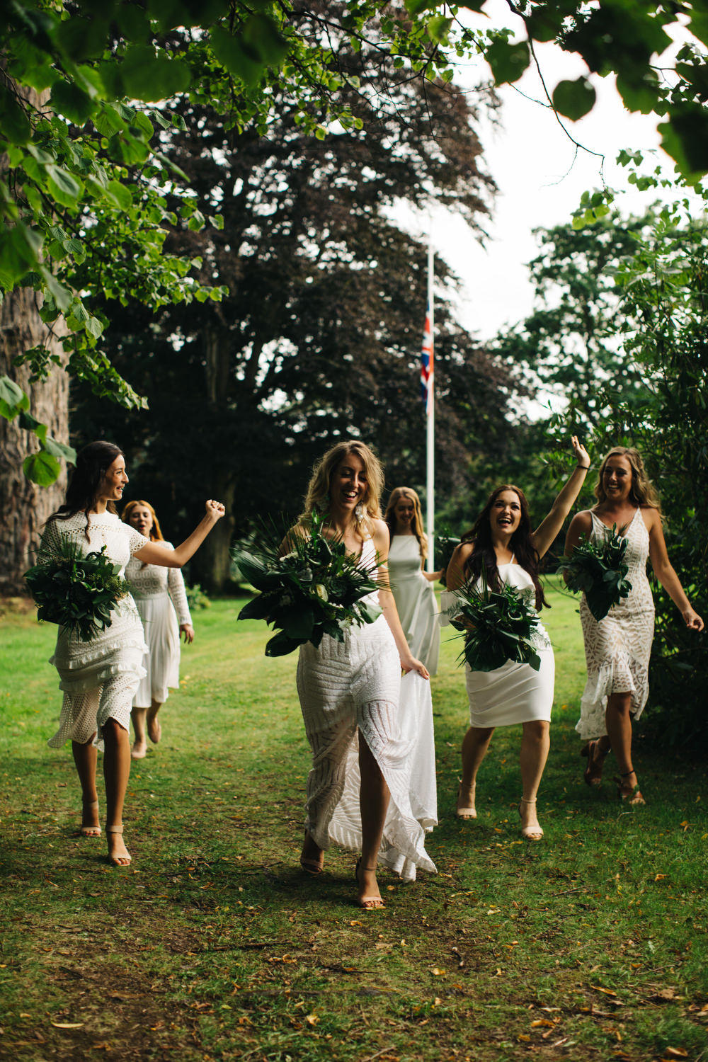 White Mismatched Bridesmaid Dresses Tropical Bouquets Palm Leaves Deer Park Country House Hotel Wedding Richard Skins Photography