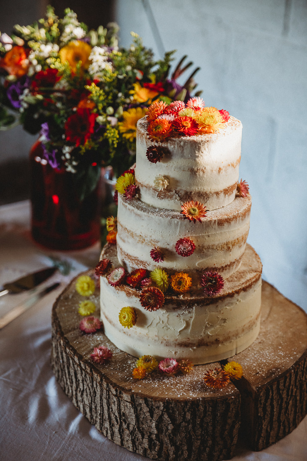 Semi Naked Cake Flowers Log Stand Furtho Manor Farm Wedding Ben Cotterill Photography