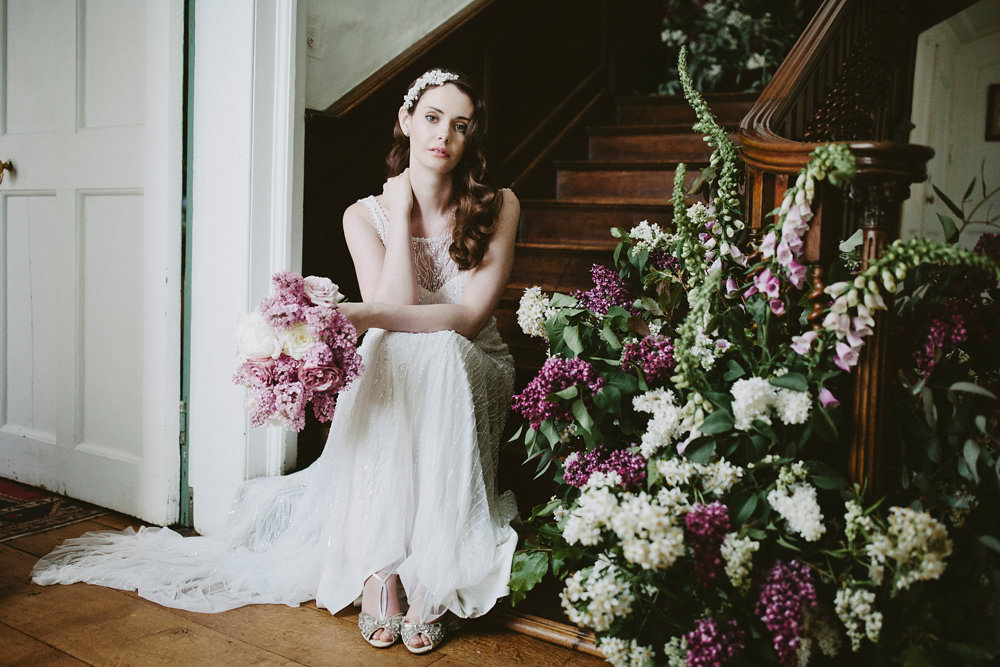 Bride Bridal Beaded Dress Gown Pearl Hairpiece Bouquet Pink White Blousy Flowers Floral Staircase Foxglove Glamorous Vintage Eggington House Wedding Ideas David Jenkins Photography
