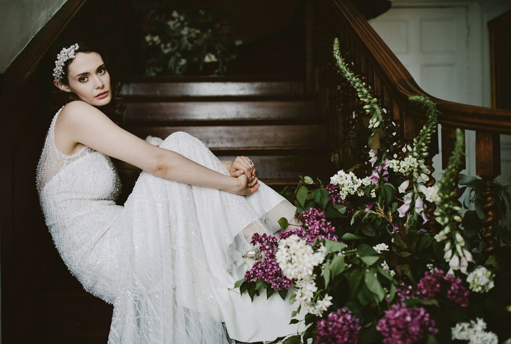 Bride Bridal Beaded Dress Gown Pearl Hairpiece Bouquet Pink White Blousy Flowers Floral Staircase Foxgloves Glamorous Vintage Eggington House Wedding Ideas David Jenkins Photography