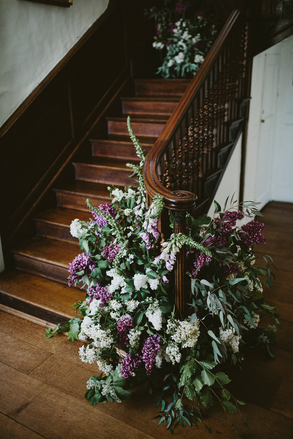 Staircase Flowers Florals Foxgloves Pink Purple Glamorous Vintage Eggington House Wedding Ideas David Jenkins Photography