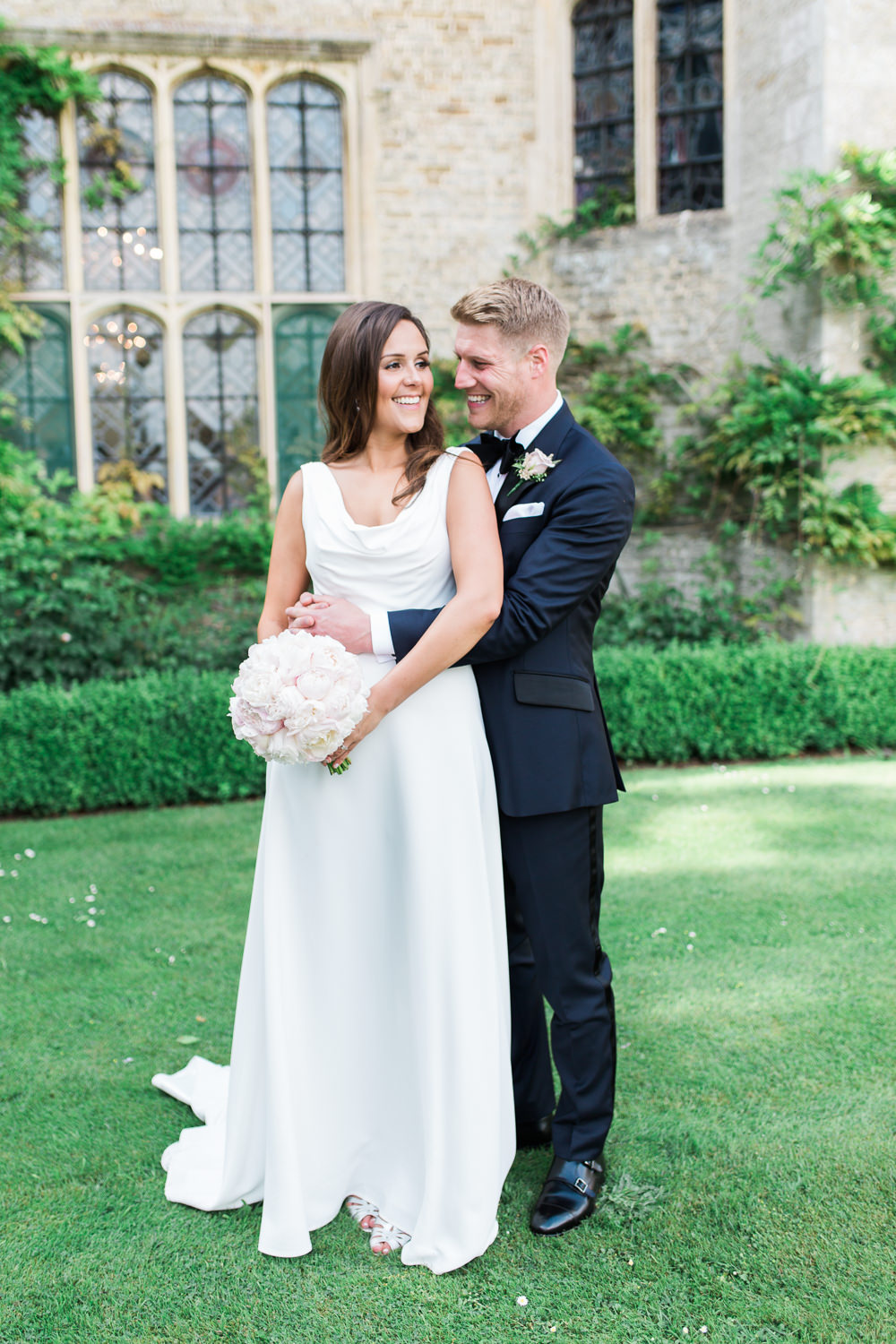 Bride Bridal Dress Gown Cowl Neck Train Tuxedo Groom Bib Waistcoat Pocket Square Peony Pink Posy Bouquet Hengrave Hall Wedding Gemma Giorgio Photography
