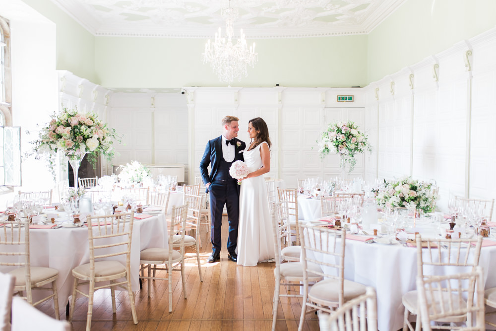 Bride Bridal Dress Gown Cowl Neck Train Tuxedo Groom Bib Waistcoat Pocket Square Tall Centrepiece Flowers Hengrave Hall Wedding Gemma Giorgio Photography