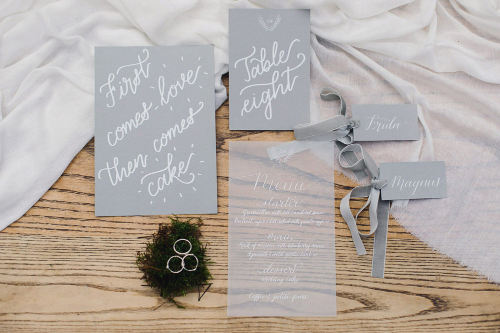 White Grey Stationery Calligraphy Invites Invitation Suite Velvet Ribbon Moss Rings Flatlay Nordic Woodland Elopement Wedding Ideas Nina Wernicke Photography