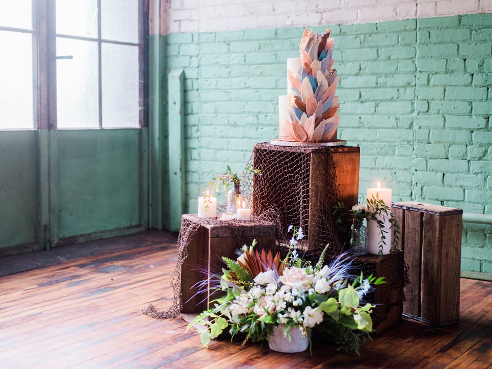 Nature Inspired Styled Shoot Seashell Grey Blue Coral Brushstroke Cake Candles Driftwood Crates | Ocean Wedding Ideas Industrial Rachel Watkinson Photography