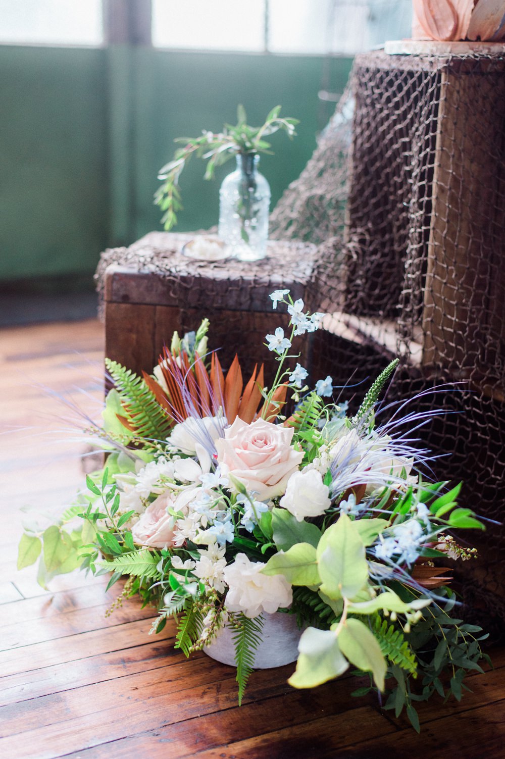 Nature Inspired Styled Shoot Seashell Grey Blue Coral Brushstroke Cake Candles Driftwood Crates | Ocean Wedding Ideas Industrial Rachel Watkinson Photography