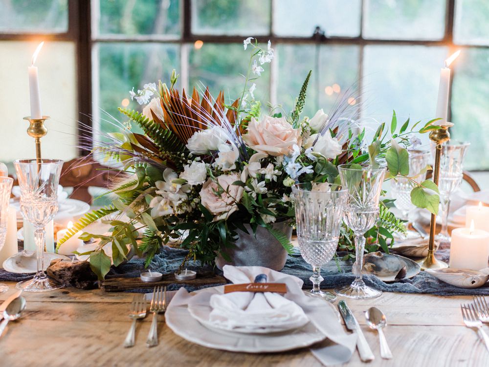 Nature Inspired Styled Shoot Seashell Tablescape Candles Grey Blue Gold Crystal Glasses Silk Ribbon Dahlia Fern Floral Centrepiece | Ocean Wedding Ideas Industrial Rachel Watkinson Photography