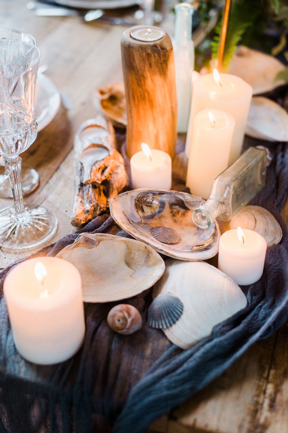 Nature Inspired Styled Shoot Seashell Tablescape Candles Grey Blue Gold Crystal Glasses Silk Ribbon Driftwood | Ocean Wedding Ideas Industrial Rachel Watkinson Photography