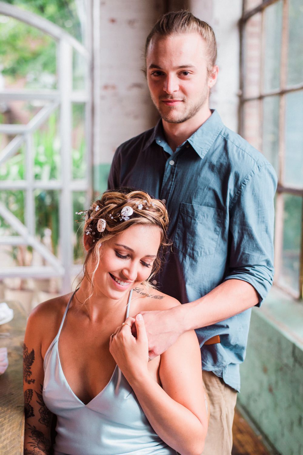 Nature Inspired Styled Shoot Seashell Headpiece Updo Tattooed Bride Blue Dress Casual Groom Shirt | Ocean Wedding Ideas Industrial Rachel Watkinson Photography