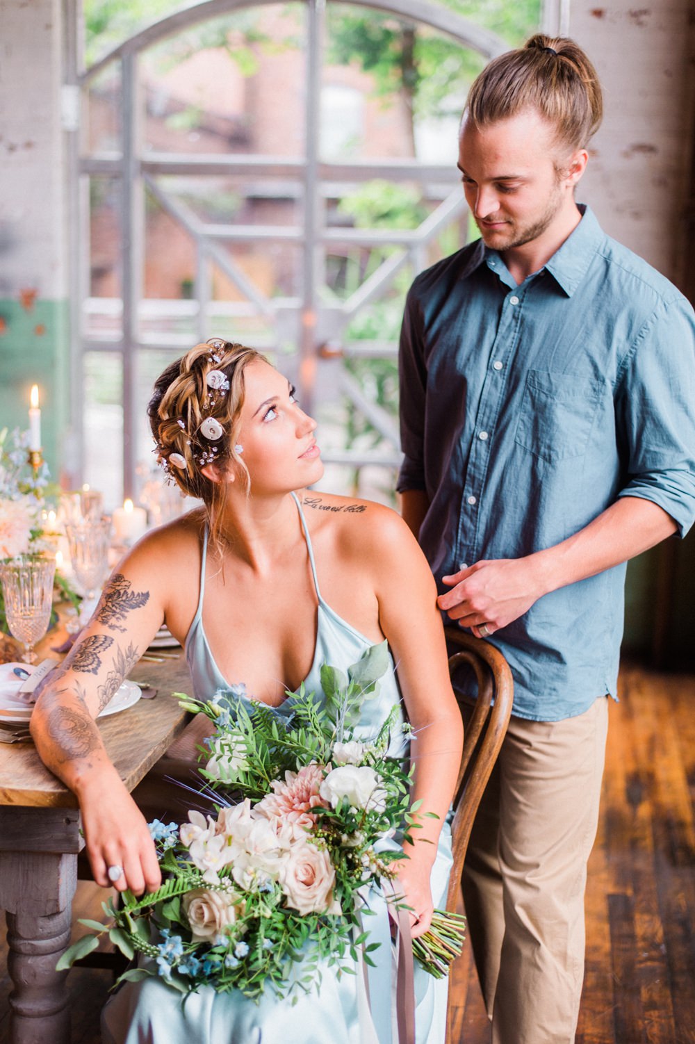 Nature Inspired Styled Shoot Seashell Headpiece Updo Tattooed Bride Blue Dress Casual Groom Shirt Pastel Dahlia Bouquet | Ocean Wedding Ideas Industrial Rachel Watkinson Photography