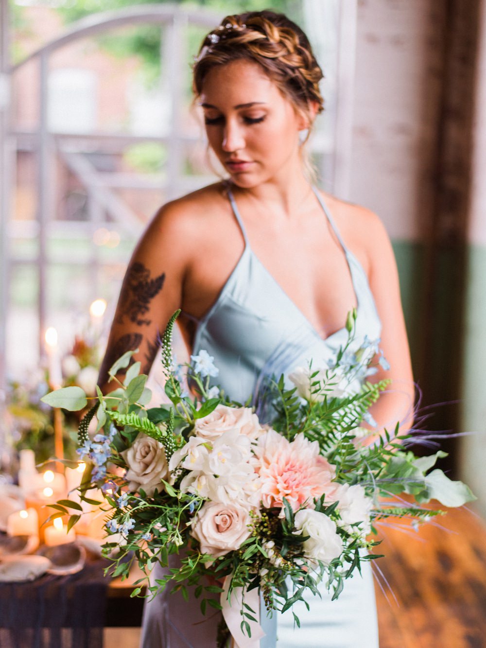 Nature Inspired Styled Shoot Seashell Headpiece Updo Tattooed Bride Blue Dress Pastel Dahlia Roses Fern Bouquet | Ocean Wedding Ideas Industrial Rachel Watkinson Photography