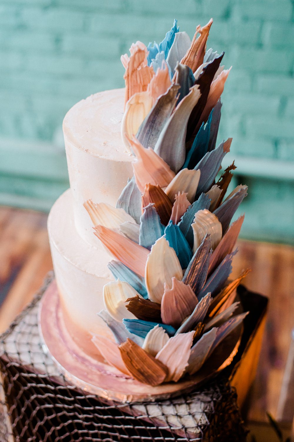 Nature Inspired Styled Shoot Seashell Grey Blue Coral Brushstroke Cake Candles Driftwood Crates | Ocean Wedding Ideas Industrial Rachel Watkinson Photography