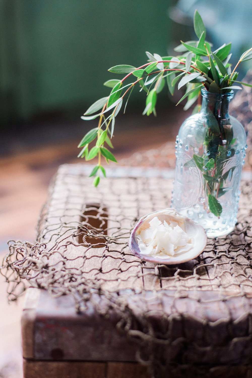 Nature Inspired Styled Shoot Blue Glass Bottle Seashell Salt Greenery Decor | Ocean Wedding Ideas Industrial Rachel Watkinson PhotographyOcean Wedding Ideas Industrial Rachel Watkinson Photography
