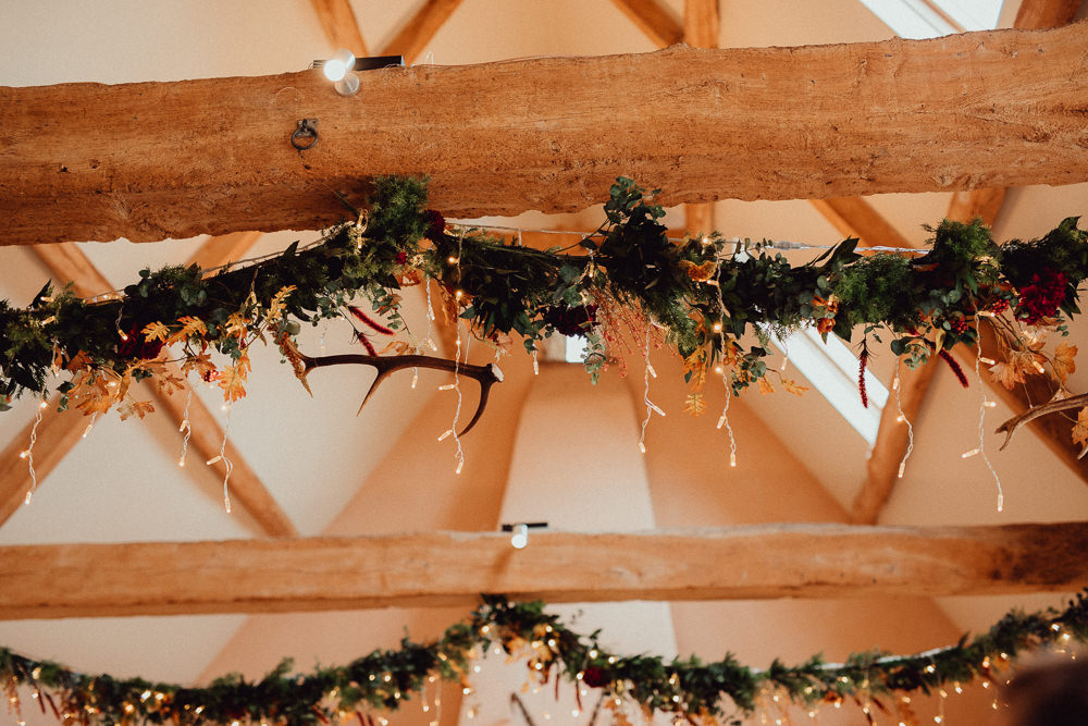 Greenery Garland Swags Ceiling Fairy Lights Ceremony Antlers Oxleaze Barn Wedding Emily and Steve Photography