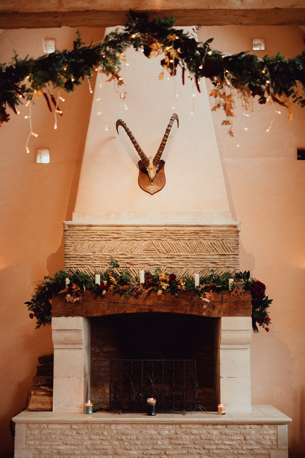 Fireplace Decor Ceremony Garlands Greenery Candles Fairylights Autumn Oxleaze Barn Wedding Emily and Steve Photography