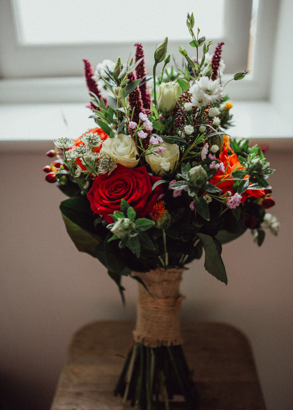 Flowers Bouquet Bride Bridal Hessian Wrap Rose Berry Red White Autumn Oxleaze Barn Wedding Emily and Steve Photography