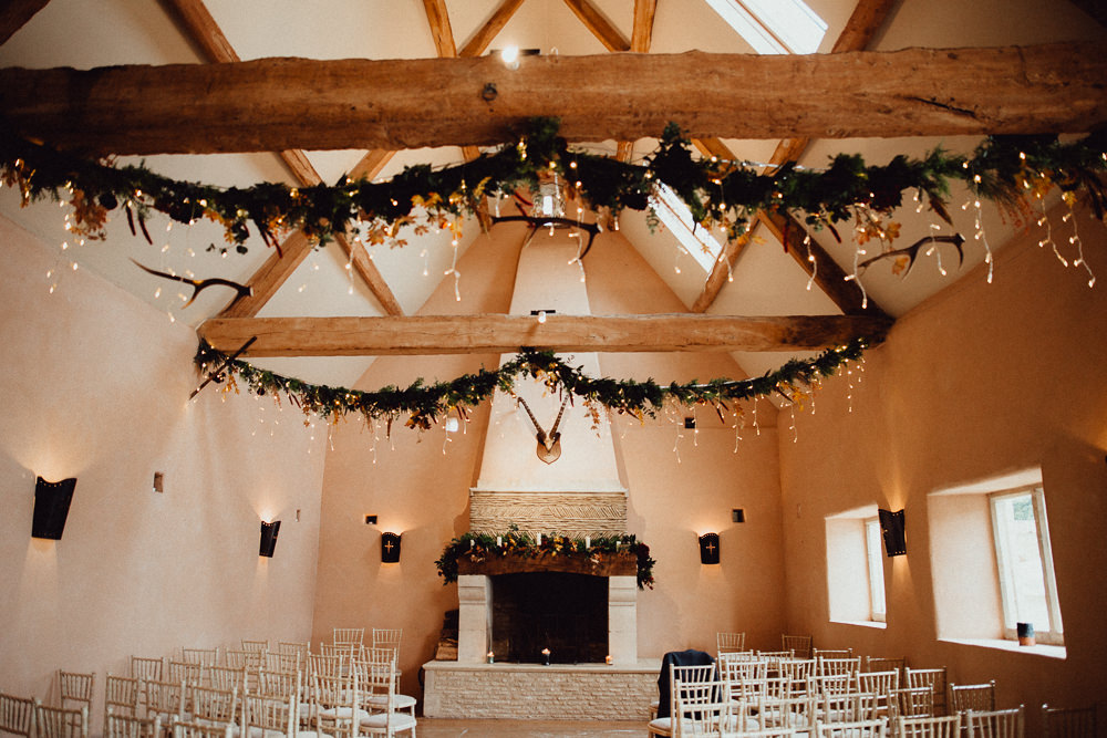 Greenery Garland Swags Ceiling Fairy Lights Ceremony Oxleaze Barn Wedding Emily and Steve Photography