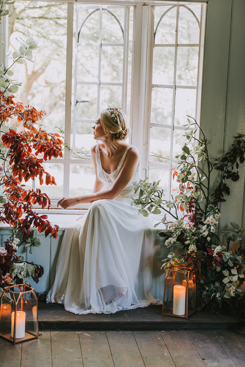 Secret Dresshouse Ethereal Bride Bridal Gown Storm Hurricane Lanterns Candles Leaf Foliage Flower Florals River Romance Wedding Ideas Mindy Coe Photography