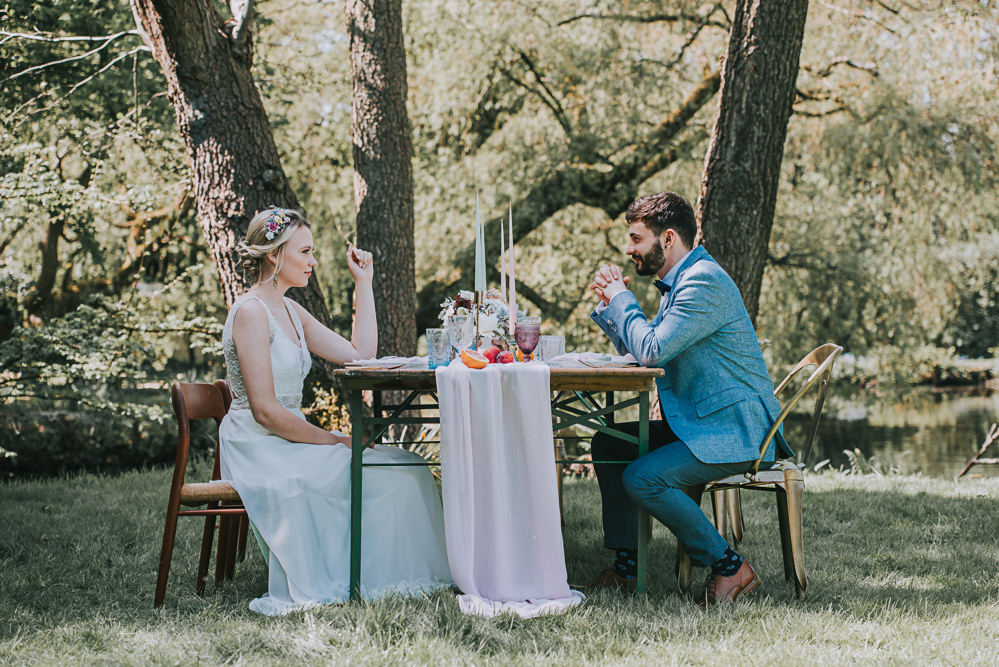 Tablescape Gold Chair Chiffon Table Runner Taper Candles Secret Dresshouse Ethereal Bride Bridal Gown Storm Hurricane Candles Lanterns Leaf Foliage Blue linen Jacket Bow Tie Groom River Romance Wedding Ideas Mindy Coe Photography