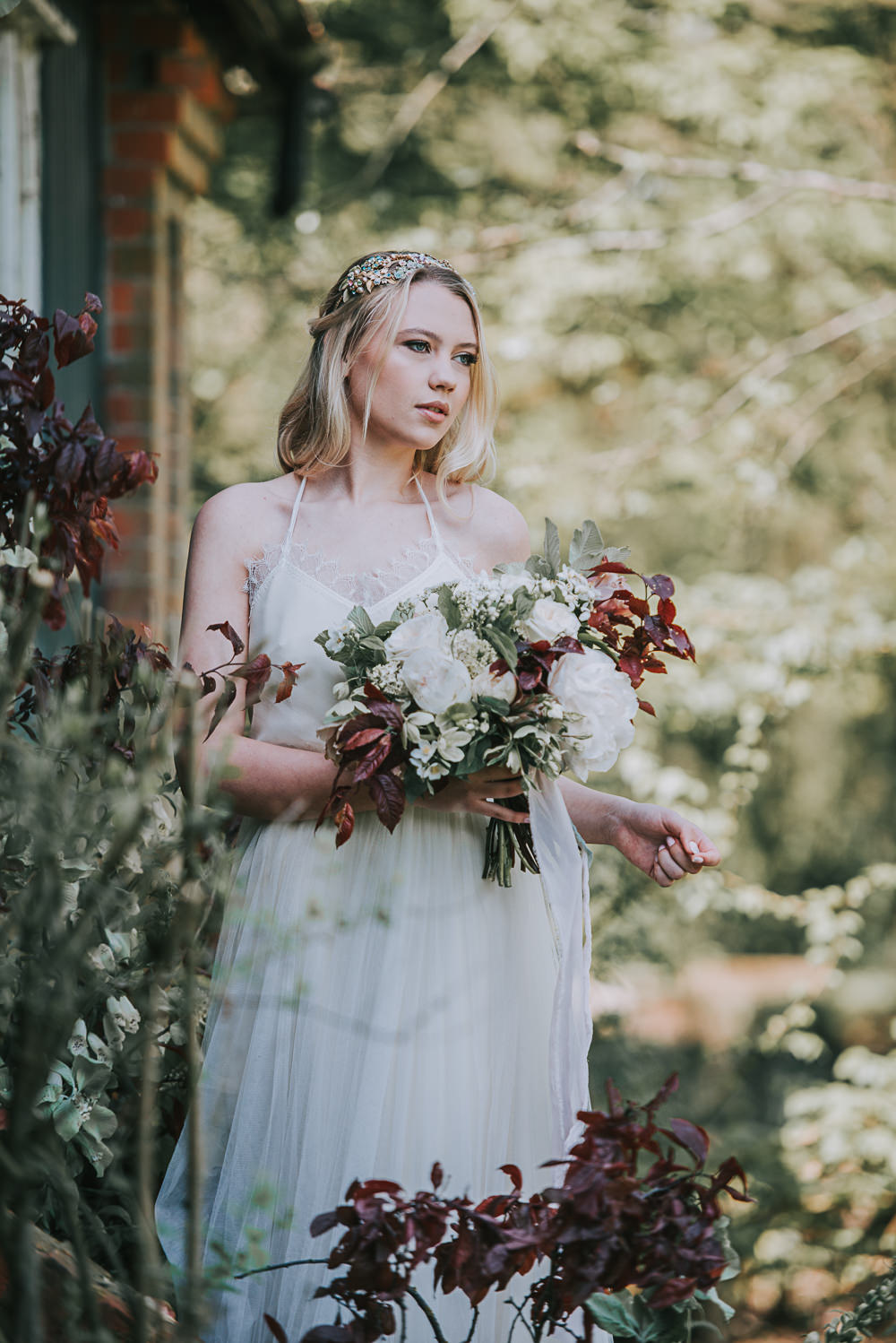 Secret Dresshouse Ethereal Bride Bridal Gown Hairpiece Leaf Foliage Flower Florals River Romance Wedding Ideas Mindy Coe Photography