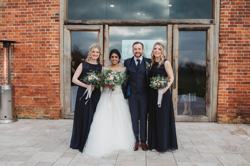Bride Bridal Lace Long Sleeve Dress Embellished A Line Veil Hair Piece Jewelled Diamante Navy Three Piece Suit Waistcoat Groom Navy Bridesmaids Bouquet Southwood Hall Wedding Emily Tyler Photography