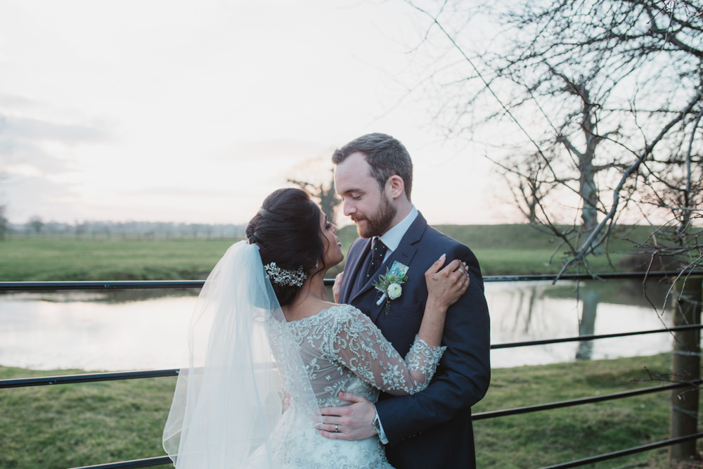 Bride Bridal Lace Long Sleeve Dress Embellished A Line Veil Hair Piece Jewelled Diamante Navy Three Piece Suit Waistcoat Groom Southwood Hall Wedding Emily Tyler Photography