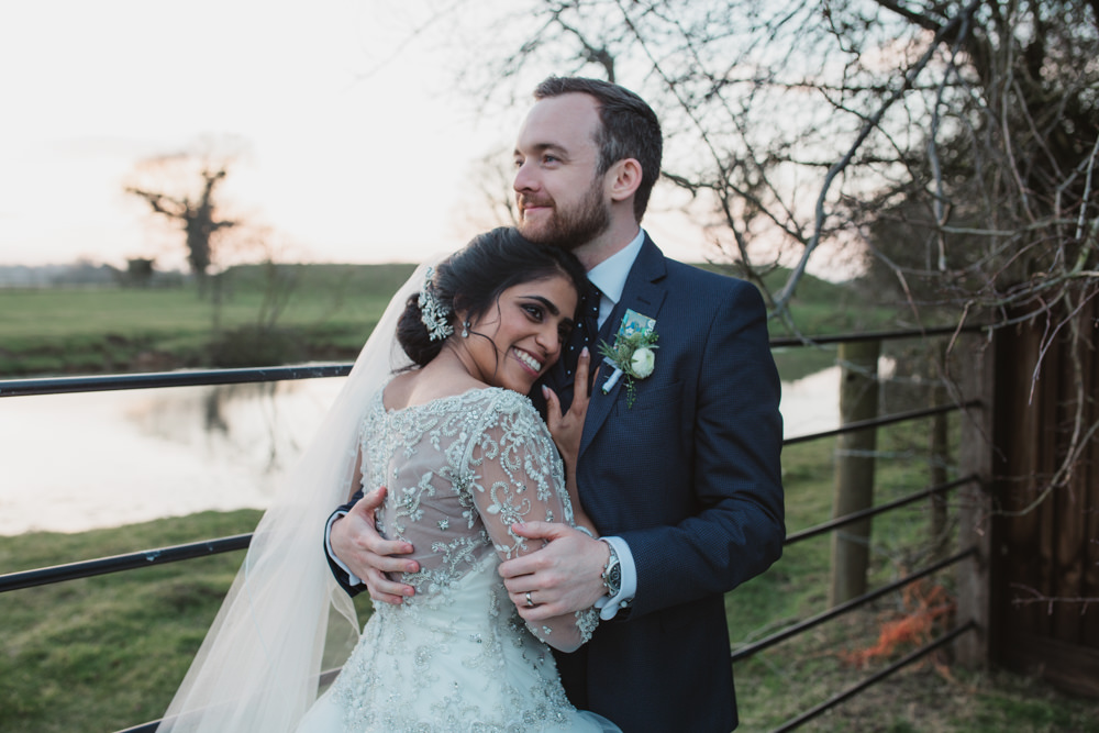 Bride Bridal Lace Long Sleeve Dress Embellished A Line Veil Hair Piece Jewelled Diamante Navy Three Piece Suit Waistcoat Groom Southwood Hall Wedding Emily Tyler Photography