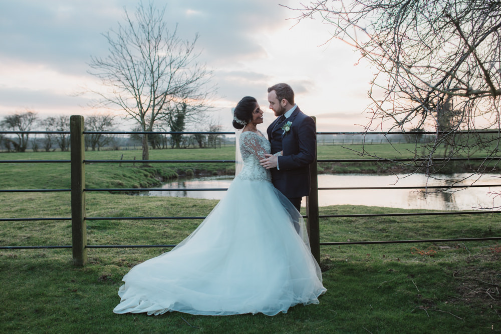 Bride Bridal Lace Long Sleeve Dress Embellished A Line Veil Hair Piece Jewelled Diamante Navy Three Piece Suit Waistcoat Groom Southwood Hall Wedding Emily Tyler Photography