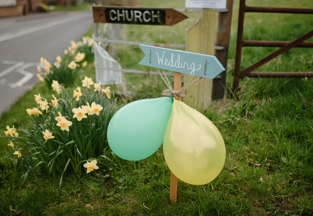 Outdoor Farm Field Marquee Green Yello Wedding Sign Church | Rustic and Relaxed Spring Tipi Wedding Inbetween Days Photography