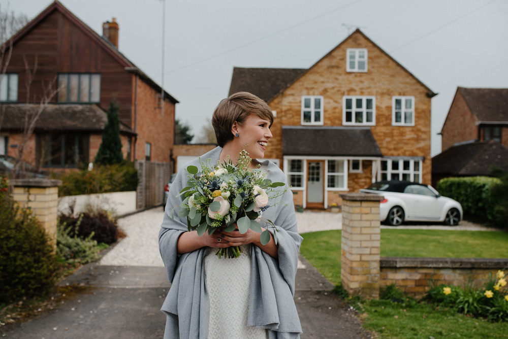 Outdoor Farm Field Marquee Bride Modern Short Pixie Cut White Green Yellow Bouquet | Rustic and Relaxed Spring Tipi Wedding Inbetween Days Photography