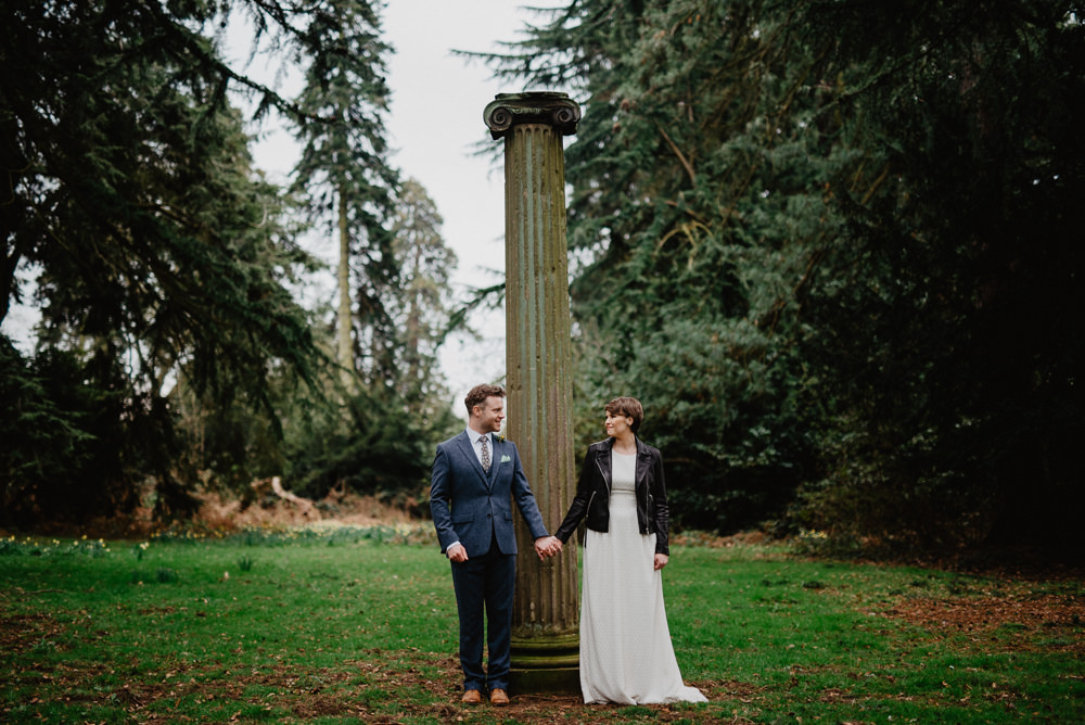 Outdoor Farm Field Marquee Groom Bride Leather Jacket Blue Suit Modern | Rustic and Relaxed Spring Tipi Wedding Inbetween Days Photography