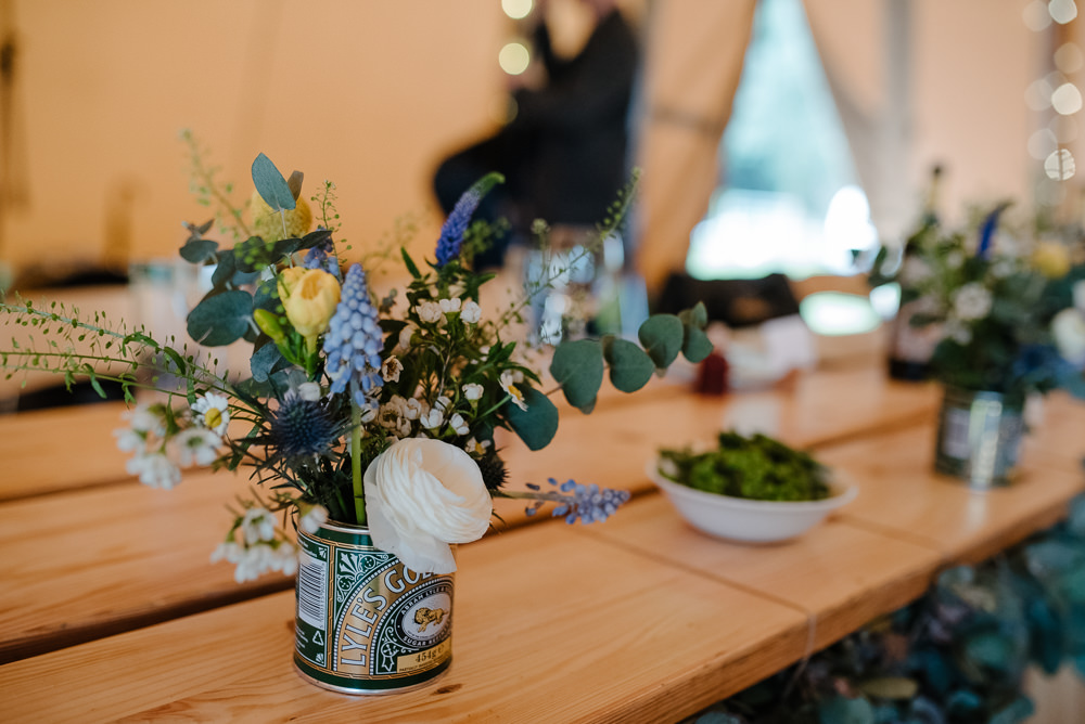 Outdoor Farm Field Marquee Tablescape Decor Blue Green Yellow Flowers Tins | Rustic and Relaxed Spring Tipi Wedding Inbetween Days Photography