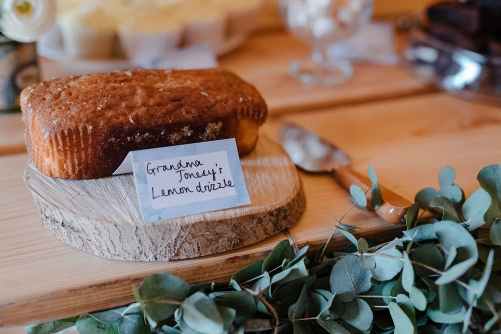 Outdoor Farm Field Marquee Tablescape Decor Greenery Lemon Drizzle Cake Log | Rustic and Relaxed Spring Tipi Wedding Inbetween Days Photography