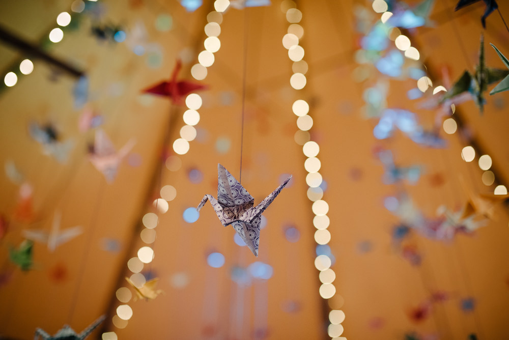 Outdoor Farm Field Marquee Decor Suspended Origami Cranes | Rustic and Relaxed Spring Tipi Wedding Inbetween Days Photography