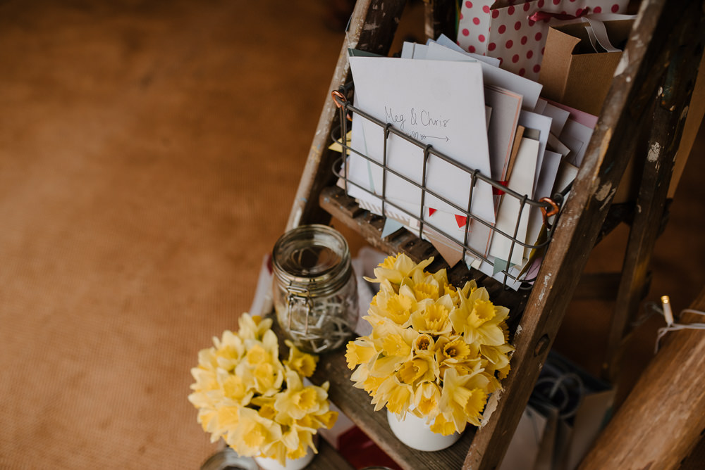 Outdoor Farm Field Marquee Decor Ladder Cards Yellow Flowers | Rustic and Relaxed Spring Tipi Wedding Inbetween Days Photography