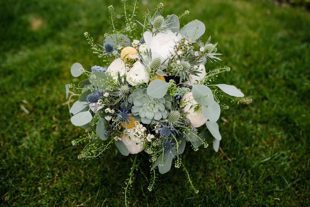 Outdoor Farm Field Marquee Blue Yellow White Bridal Bouquet Succulent | Rustic and Relaxed Spring Tipi Wedding Inbetween Days Photography