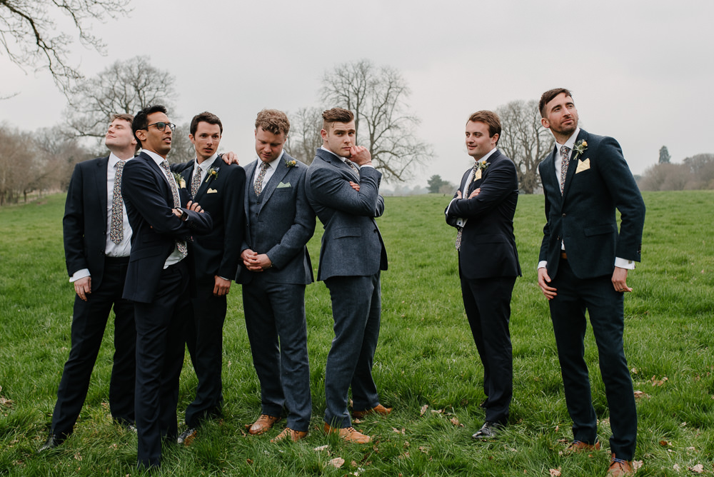 Outdoor Farm Field Marquee Groom Groomsmen Blue Navy Suits Yellow Buttonholes | Rustic and Relaxed Spring Tipi Wedding Inbetween Days Photography