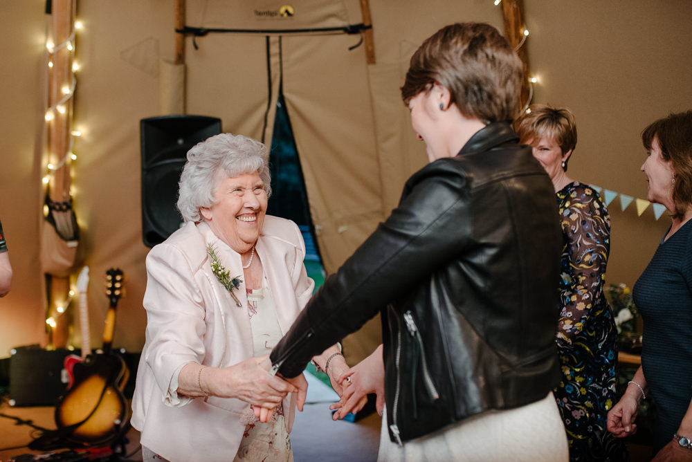 Outdoor Farm Field Marquee Leather Jacket Bride Family First Dance | Relaxed and Rustic Spring Tipi Wedding Inbetween Days Photography